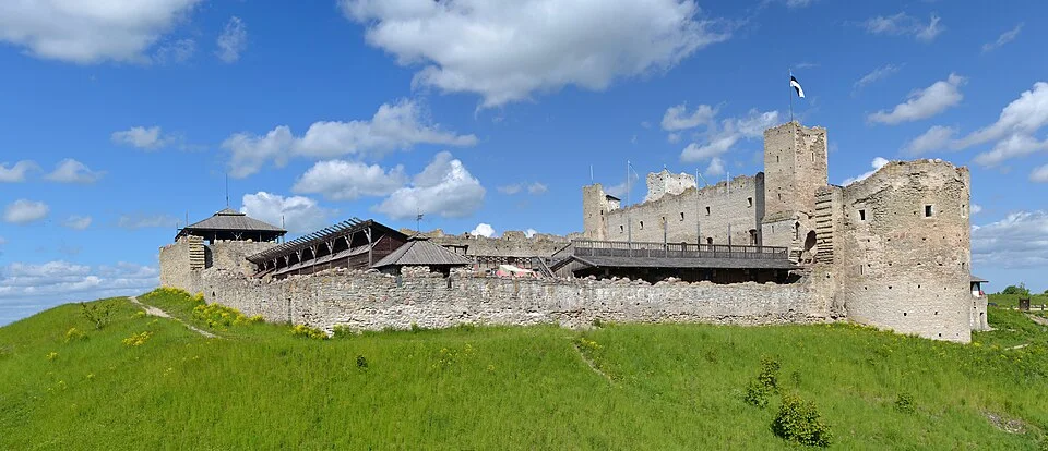 Rakvere Castle walls and towers above a grassy moat